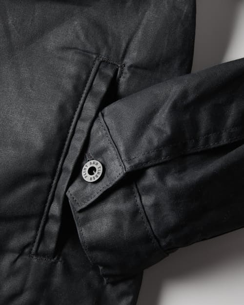 laydown detail image of Flannel-Lined Waxed Trucker Jacket