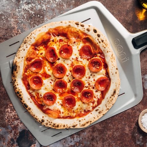 lifestyle image of 12" Perforated Pizza Peel