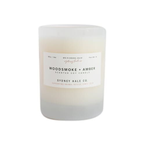 lifestyle image of Woodsmoke + Amber Candle