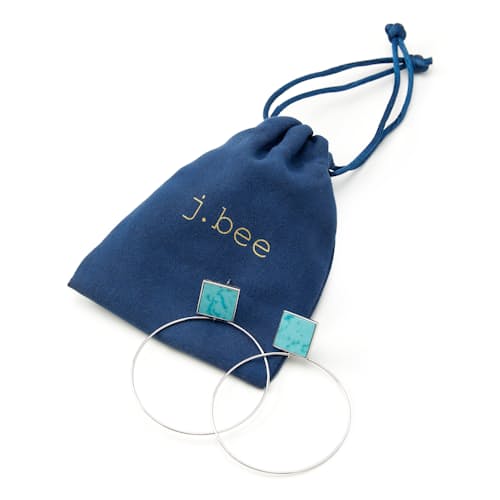 laydown image of Women's Silver Turquoise Hoop Earrings