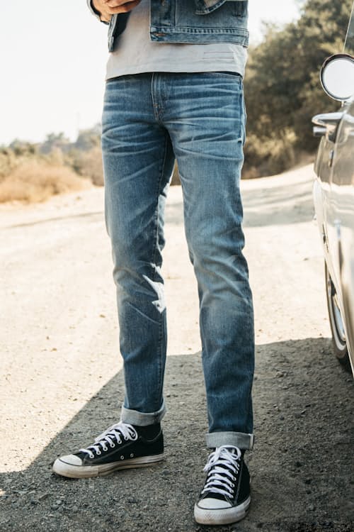 lifestyle image of The Pen Slim Straight Stretch Selvedge Denim Jeans