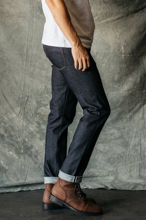 lifestyle image of The Pen Slim Straight Stretch Selvedge Denim Jeans