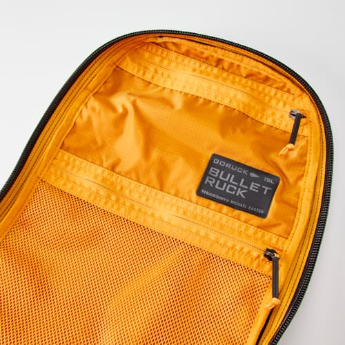 laydown detail image of Michael Easter 2% Collection Bullet Backpack - 15L