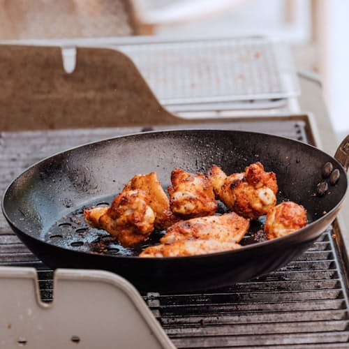 lifestyle image of 12" Carbon Steel Grill Fry Pan (Seasoned)