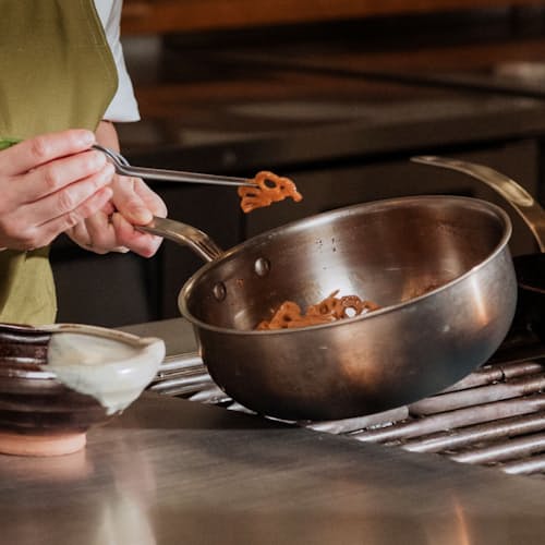 lifestyle image of 3 Qt Stainless Clad Saucier