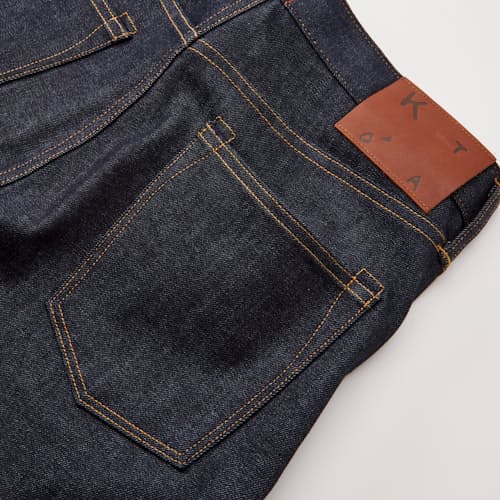 laydown detail image of The Scissors Slim Tapered Stretch Selvedge Denim Jeans