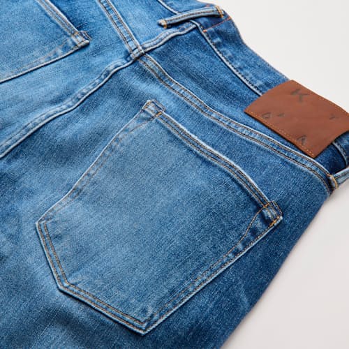 laydown detail image of The Scissors Slim Tapered Stretch Selvedge Denim Jeans