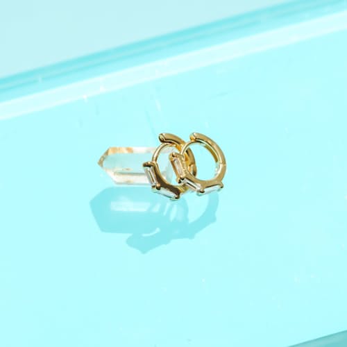 lifestyle image of Women's Stacked Diamond Huggie Earrings