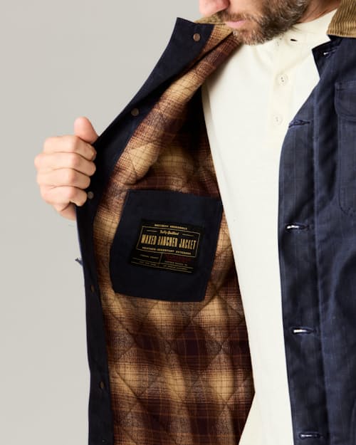 lifestyle image of Flannel-Lined Quilted Waxed Rancher Jacket