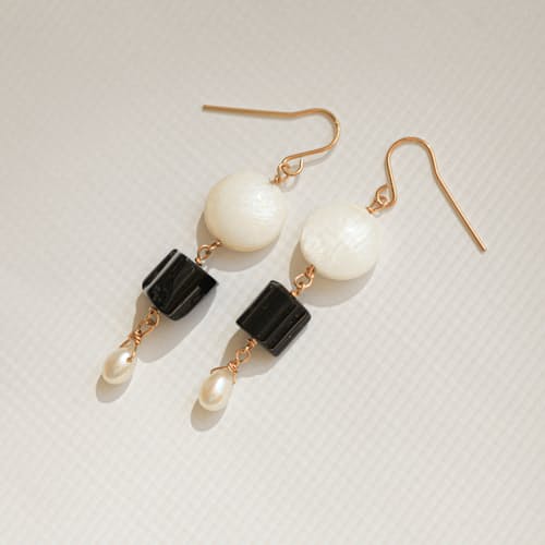 laydown image of Black Tourmaline + Pearl Earring