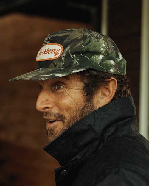 lifestyle image of Camo Script Patch Hat