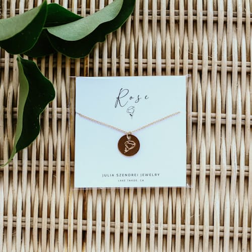 laydown image of Rose Flower Coin Necklace