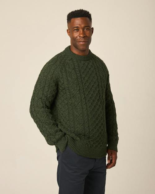 on model image of Hudson Aran Sweater
