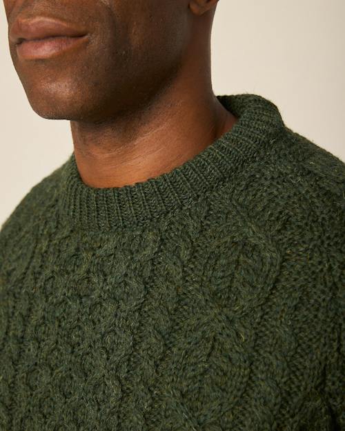 on model image of Hudson Aran Sweater
