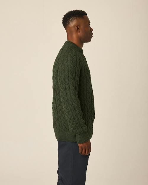 on model image of Hudson Aran Sweater