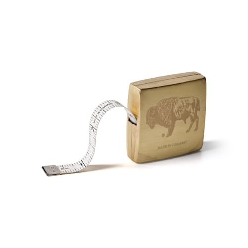 laydown image of Brass Measuring Tape - Engraved Bison
