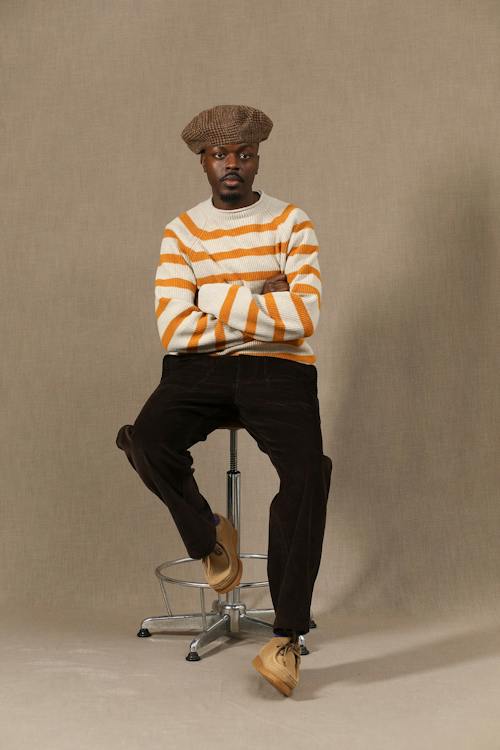 on model image of Kobe Rolled Neck Sweater