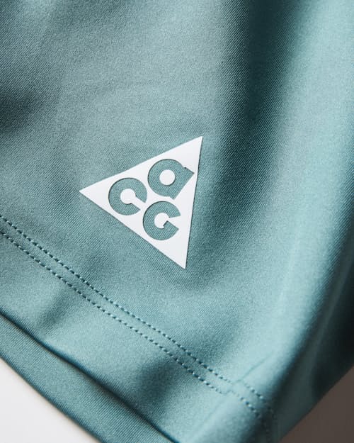 laydown detail image of ACG Dri Fit Advanced Lava Loop Half Tight