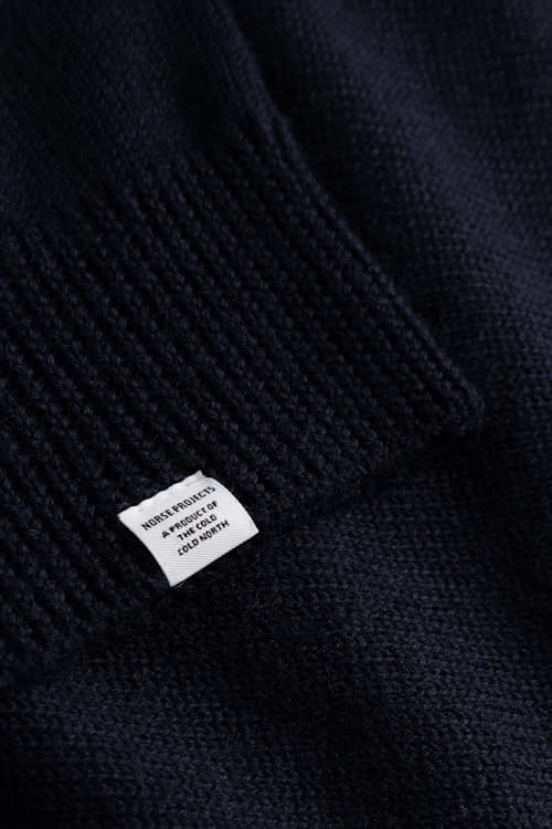 laydown detail image of Sagvatnet Wool Roll Neck Sweater
