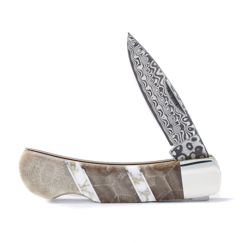 laydown image of Rare Petoskey Fossil + Jasper Damascus Knife