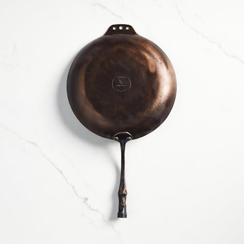 laydown image of Carbon Steel Farmhouse Skillet