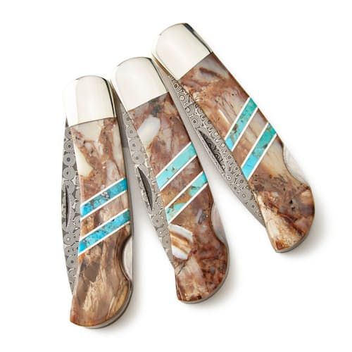 laydown image of White Mammoth Tusk + Turquoise Damascus Knife