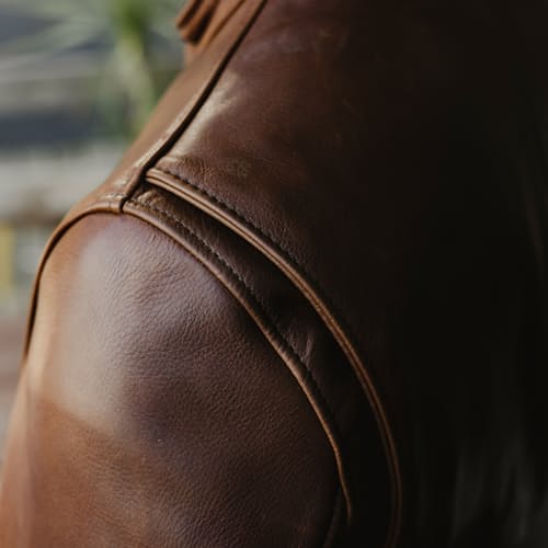 lifestyle image of Waxed Natural Pebbled Cowhide Cafe Leather Jacket
