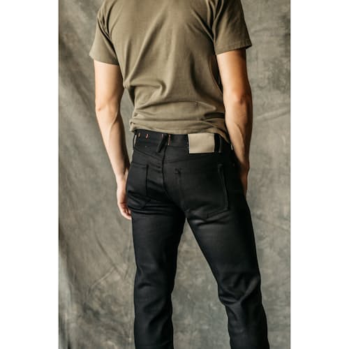 on model image of The Pen Slim Straight Stretch Selvedge Denim Jeans