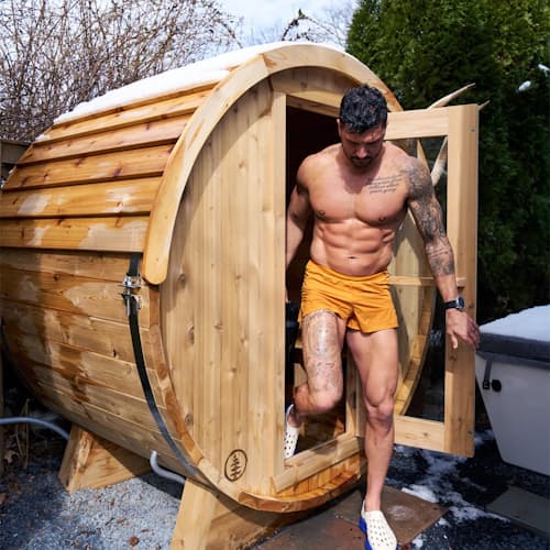 lifestyle image of The Eddy Barrel Sauna with Roof Kit