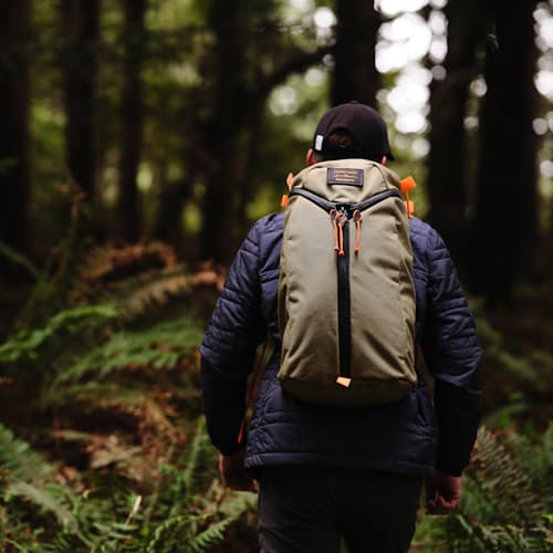 laydown image of Huckberry x Mystery Ranch Urban Assault 21L