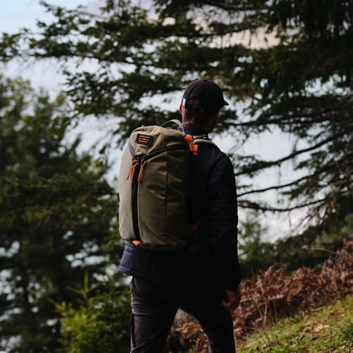 laydown image of Huckberry x Mystery Ranch Urban Assault 21L