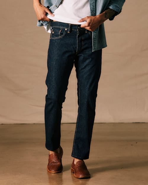 on model image of Slim Fit Selvedge Denim Jeans