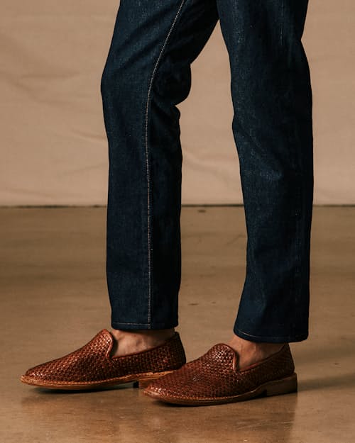 on model image of Slim Fit Selvedge Denim Jeans