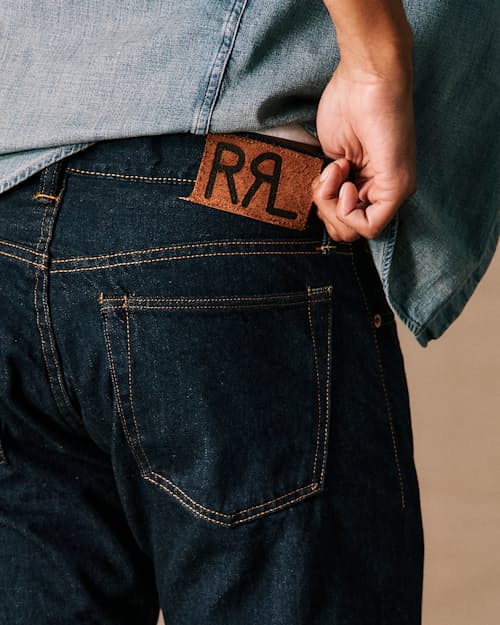 on model image of Slim Fit Selvedge Denim Jeans