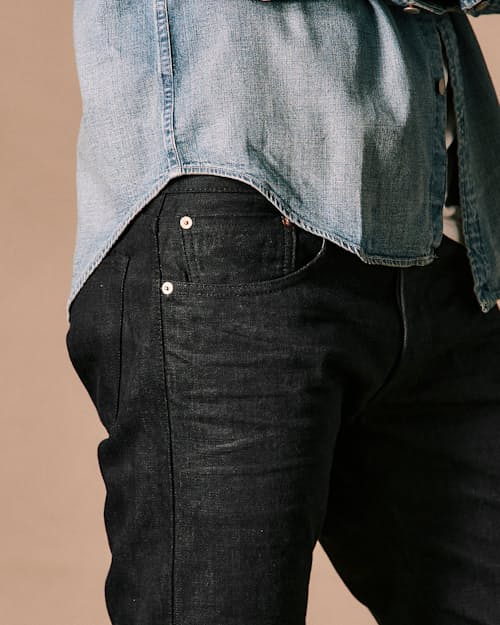 on model image of Slim Fit Selvedge Denim Jeans