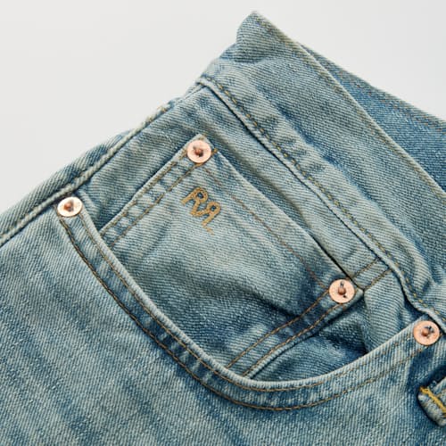 lifestyle image of Slim Fit Selvedge Denim Jeans