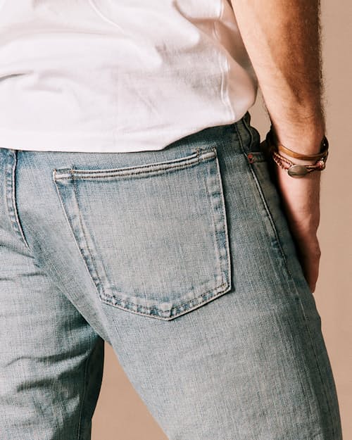 on model image of Slim Fit Selvedge Denim Jeans
