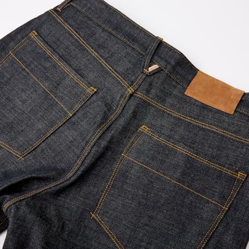 laydown image of Graham Relaxed Tapered Denim Jeans