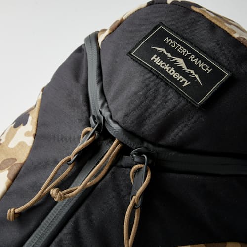 laydown image of Huckberry X Mystery Ranch Urban Assault - 21L Backpack