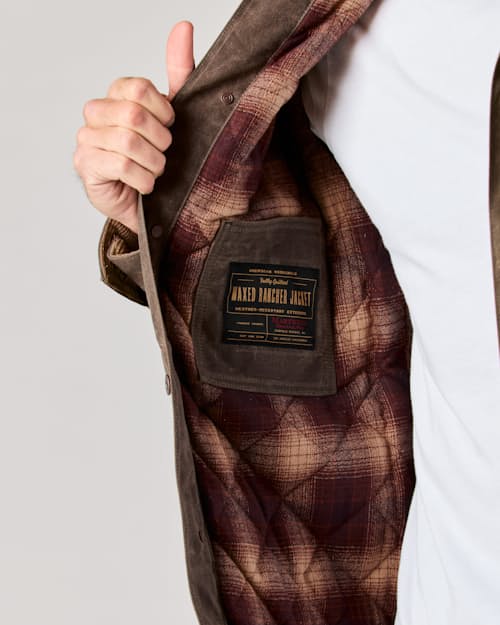 lifestyle image of Flannel-Lined Quilted Waxed Rancher Jacket