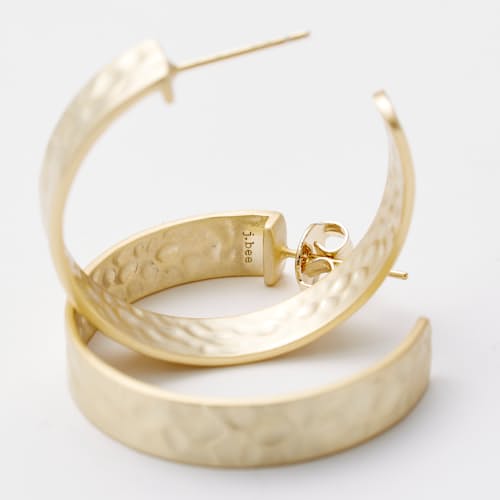 laydown detail image of Women's Hammered Gold Hoop Earrings