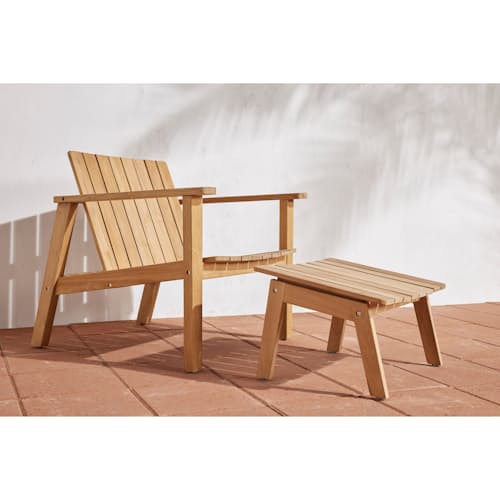 lifestyle image of The Outdoor Low Chair + The Ottoman