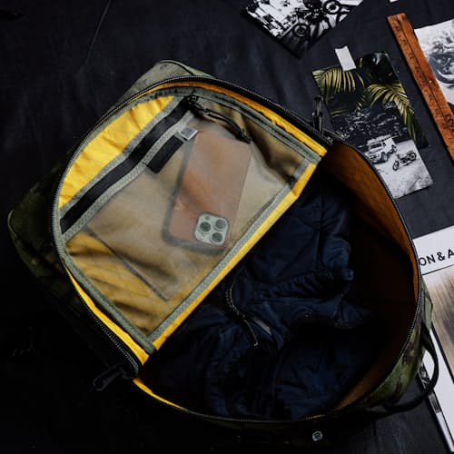 laydown image of Huckberry X The Brown Buffalo Conceal Backpack 21L