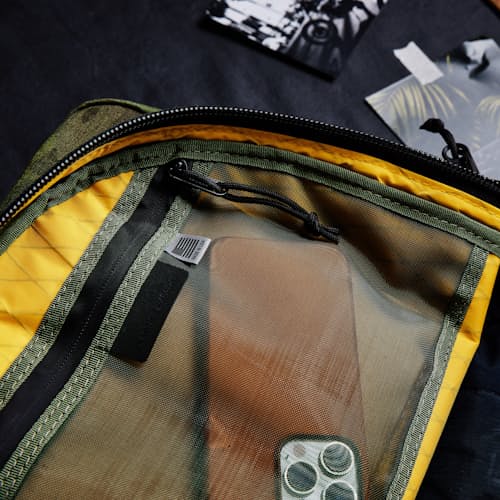 laydown image of Huckberry X The Brown Buffalo Conceal Backpack 21L