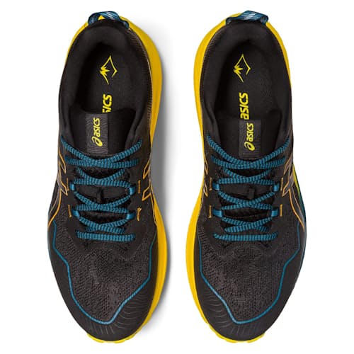 laydown image of Gel Trabuco 11 Trail Running Shoe