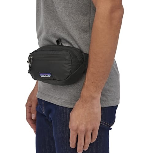on model image of Ultralight Black Hole Mini Hip Pack - 1L