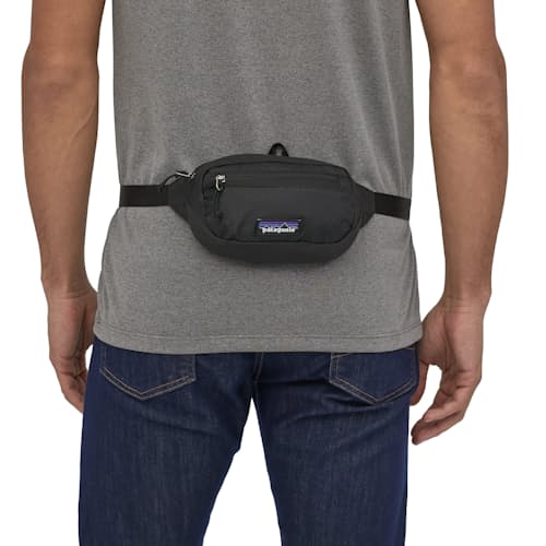 on model image of Ultralight Black Hole Mini Hip Pack - 1L