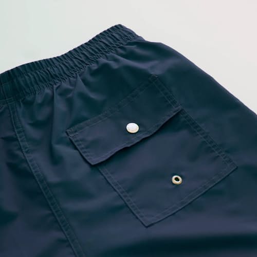 laydown image of Classic Solid Swim Short - 5.5"