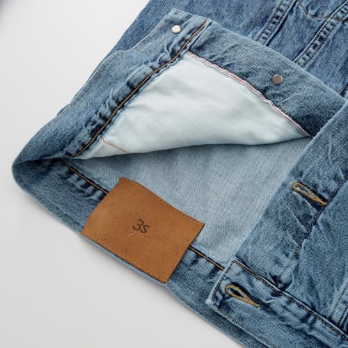 lifestyle image of Stonewashed Denim Trucker Jacket