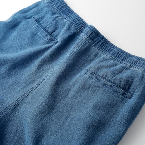 laydown image of Washed Indigo Drawstring Trousers
